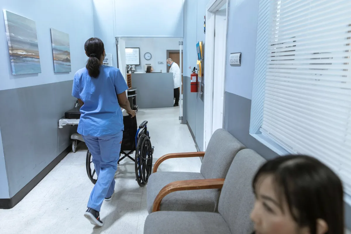 Nurse moving through a community hospital hallway